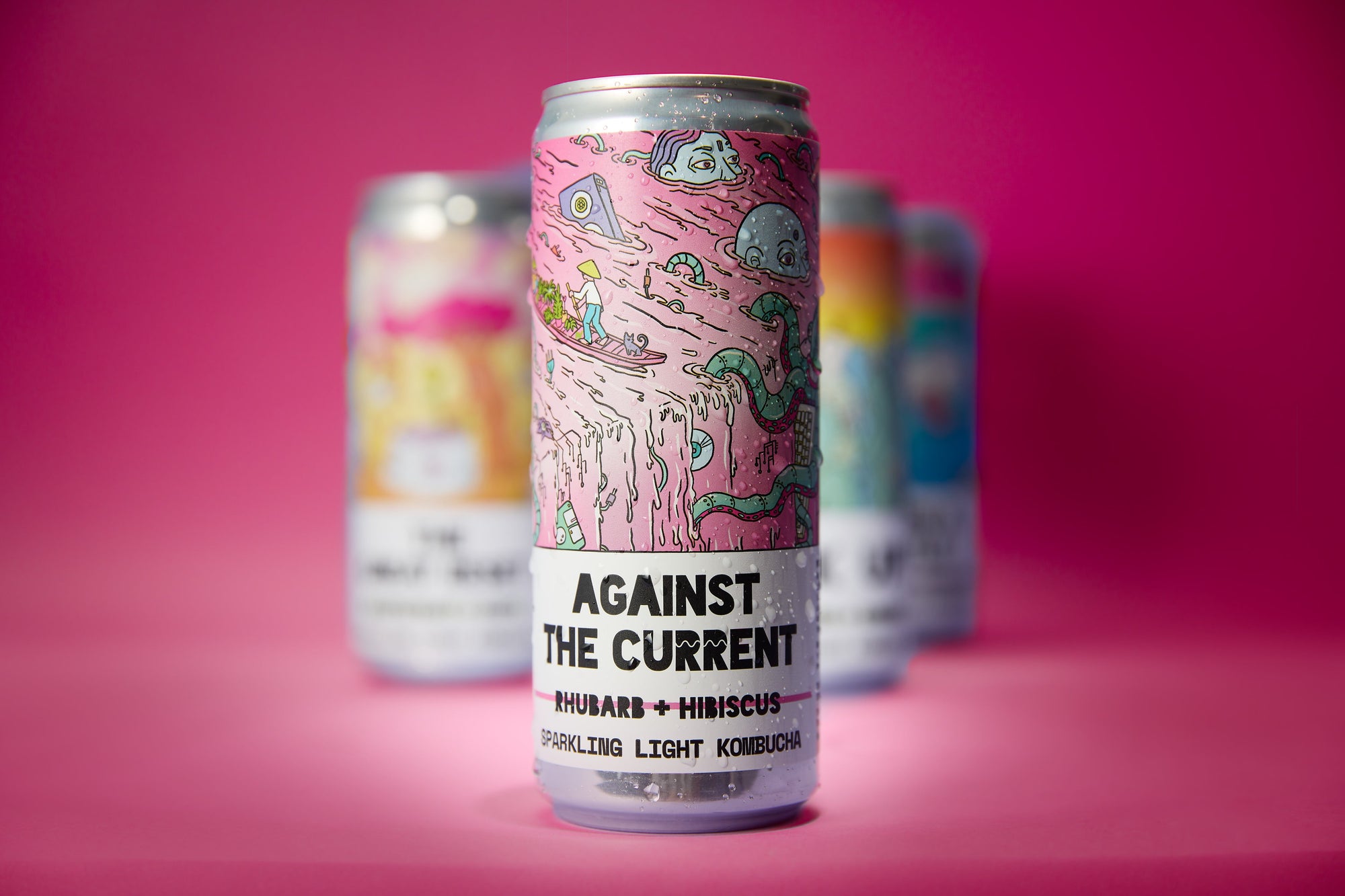 Counter Culture Drinks kombucha cans with magenta background